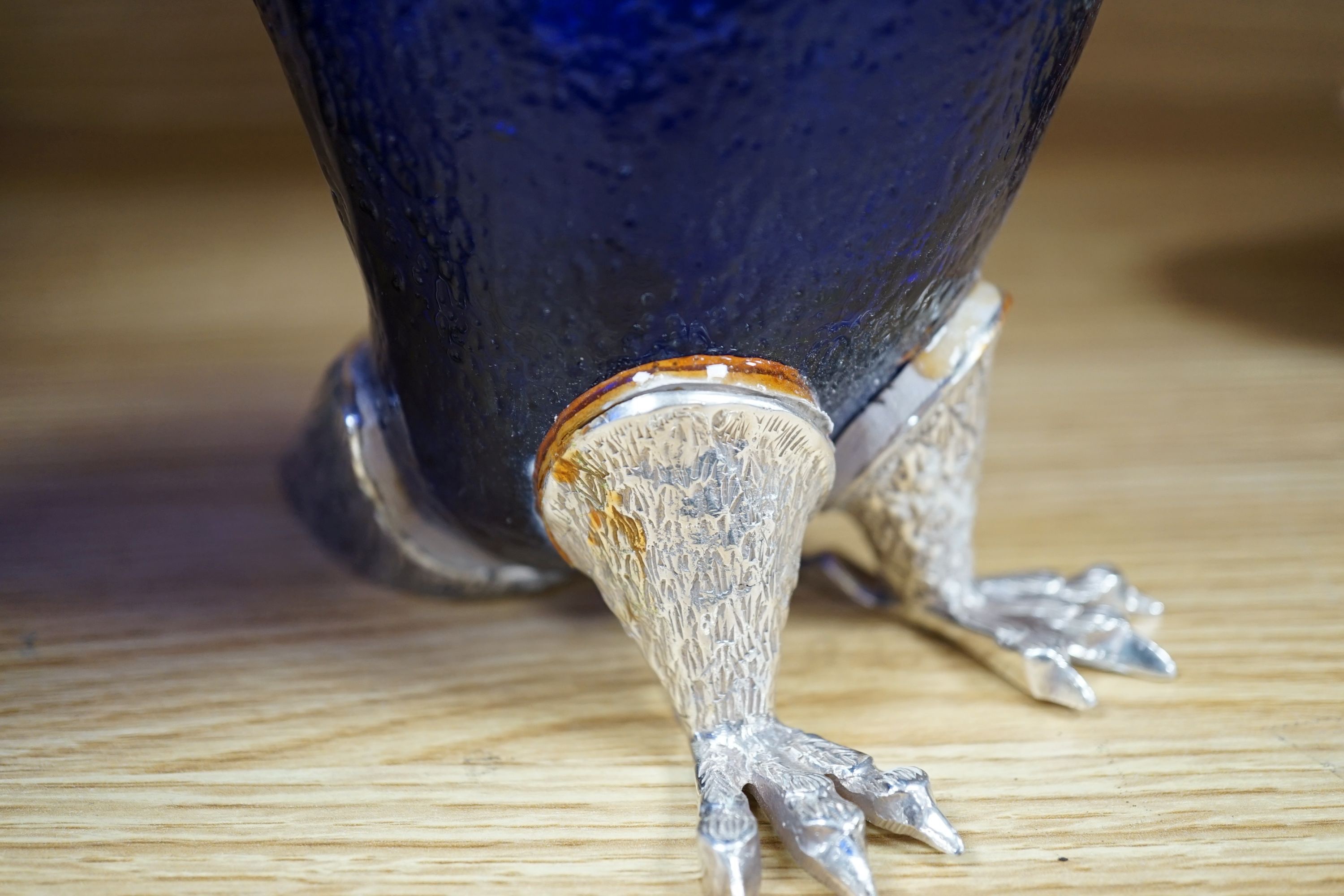 A pair of modern silver plated and blue glass novelty owl flasks, 28.5 cms high.